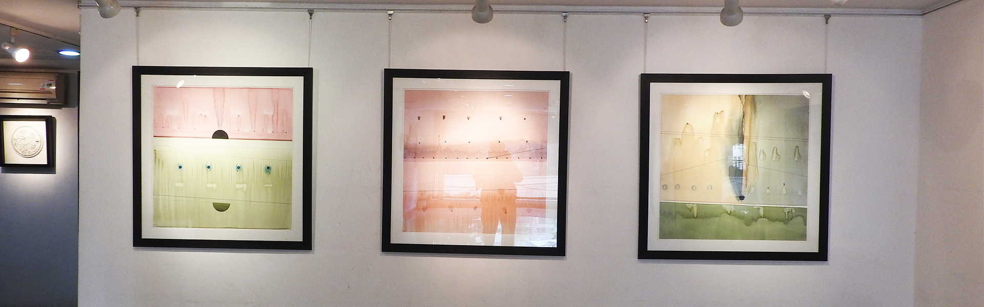 Contemporary art exhibition showcasing framed artworks at Aakriti Art Gallery